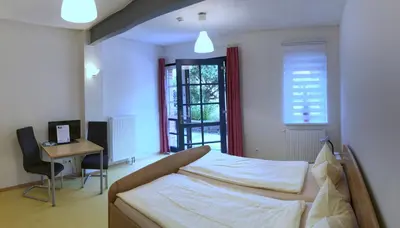 Ein Bett oder Betten in einem Zimmer der Unterkunft Hof Märkische Heide