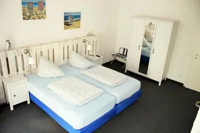 Ein Bett oder Betten in einem Zimmer der Unterkunft Botschaft