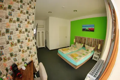 Ein Bett oder Betten in einem Zimmer der Unterkunft Botschaft