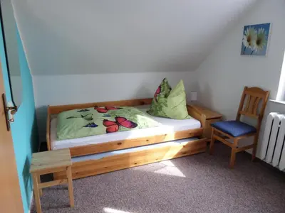 Ein Bett oder Betten in einem Zimmer der Unterkunft Fewo 