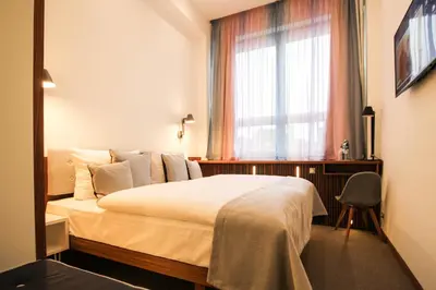 Ein Bett oder Betten in einem Zimmer der Unterkunft H24 Berlin Lichtenberg