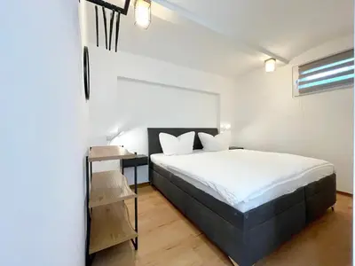 Ein Bett oder Betten in einem Zimmer der Unterkunft Spreewaldapartments-Kossatz