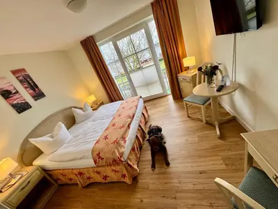 Ein Bett oder Betten in einem Zimmer der Unterkunft Altes Kasino Hotel am See