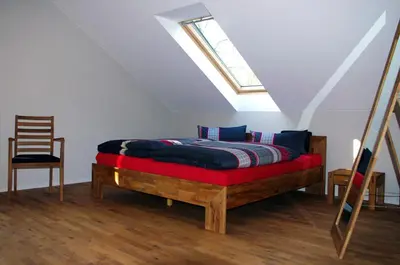 Ein Bett oder Betten in einem Zimmer der Unterkunft Forsthaus Sommerswalde