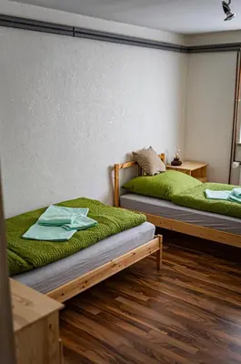 Ein Bett oder Betten in einem Zimmer der Unterkunft Zimmervermietung Familie Schuster