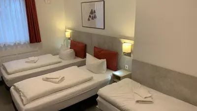 Ein Bett oder Betten in einem Zimmer der Unterkunft TRIO Apartment Hotel Berlin