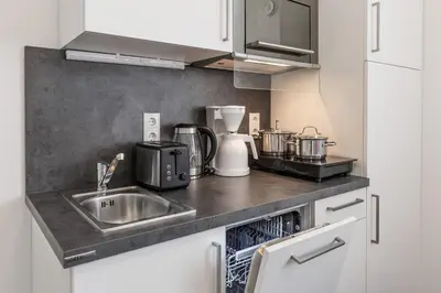 Küche/Küchenzeile in der Unterkunft TRIO Apartment Hotel Berlin