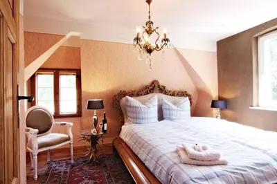 Ein Bett oder Betten in einem Zimmer der Unterkunft Schloss Stülpe