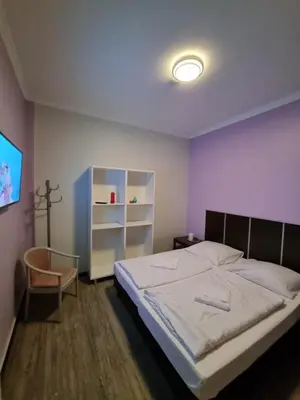 Ein Bett oder Betten in einem Zimmer der Unterkunft Albert rooms