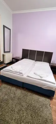 Ein Bett oder Betten in einem Zimmer der Unterkunft Albert rooms