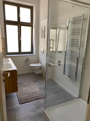 Ein Badezimmer in der Unterkunft Ferienwohnungen auf der Insel am Cafe Jacob