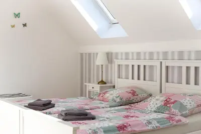 Ein Bett oder Betten in einem Zimmer der Unterkunft Landhof Potsdam