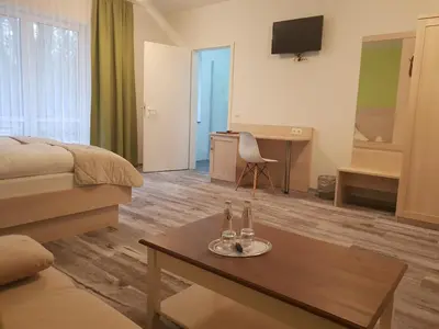 Ein Bett oder Betten in einem Zimmer der Unterkunft Neue Mühle Kleines Landhotel