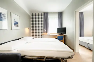 Ein Bett oder Betten in einem Zimmer der Unterkunft enjoy hotel Berlin City Messe