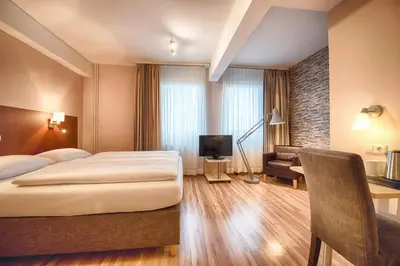 Ein Bett oder Betten in einem Zimmer der Unterkunft enjoy hotel Berlin City Messe