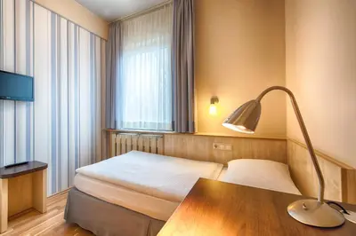 Ein Bett oder Betten in einem Zimmer der Unterkunft enjoy hotel Berlin City Messe