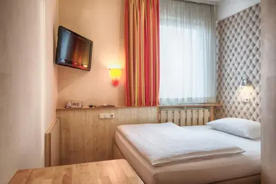 Ein Bett oder Betten in einem Zimmer der Unterkunft enjoy hotel Berlin City Messe