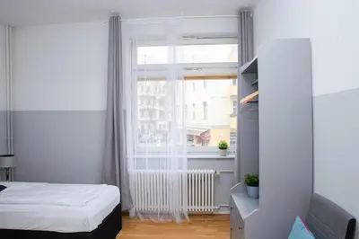 Ein Bett oder Betten in einem Zimmer der Unterkunft BIG Central City Apartment West Kurfurstendamm