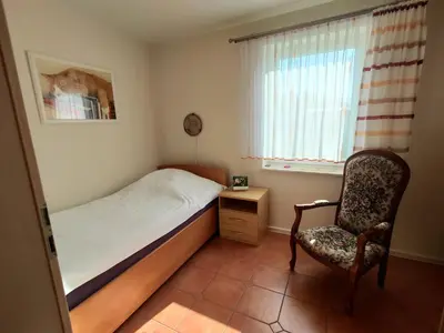 Ein Bett oder Betten in einem Zimmer der Unterkunft Ferienwohnungen Amselweg