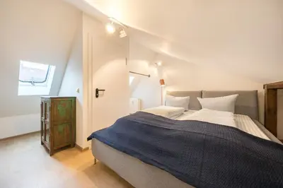 Ein Bett oder Betten in einem Zimmer der Unterkunft Design Apartments - 