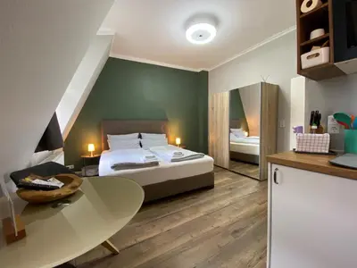 Ein Bett oder Betten in einem Zimmer der Unterkunft Amaroo - Rooms & Apartments 