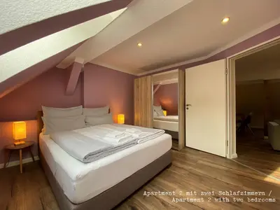Ein Bett oder Betten in einem Zimmer der Unterkunft Amaroo - Rooms & Apartments 