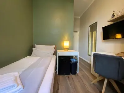 Ein Bett oder Betten in einem Zimmer der Unterkunft Amaroo - Rooms & Apartments 
