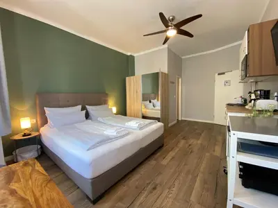 Ein Bett oder Betten in einem Zimmer der Unterkunft Amaroo - Rooms & Apartments 