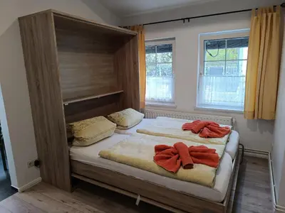 Ein Bett oder Betten in einem Zimmer der Unterkunft Kastanienhof Lübben