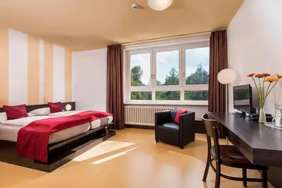 Ein Bett oder Betten in einem Zimmer der Unterkunft Hotel Grenzfall