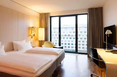 Ein Bett oder Betten in einem Zimmer der Unterkunft Scandic Berlin Potsdamer Platz