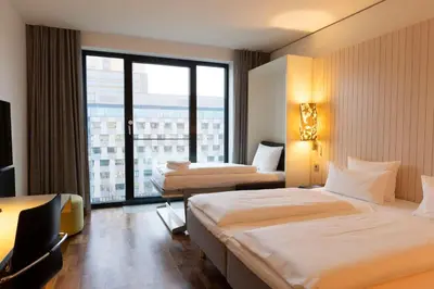 Ein Bett oder Betten in einem Zimmer der Unterkunft Scandic Berlin Potsdamer Platz