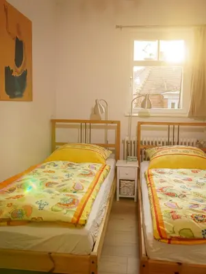 Ein Bett oder Betten in einem Zimmer der Unterkunft Ferienwohnung Berlin