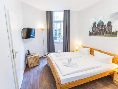 Ein Bett oder Betten in einem Zimmer der Unterkunft Pension Marie Prenzlauer Berg