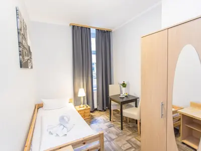 Ein Bett oder Betten in einem Zimmer der Unterkunft Pension Marie Prenzlauer Berg