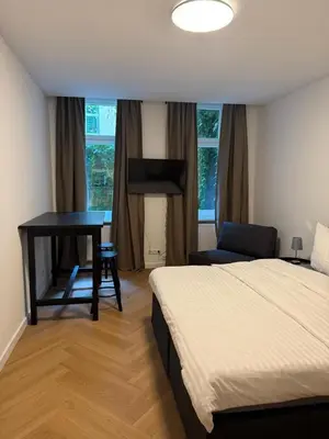 Ein Bett oder Betten in einem Zimmer der Unterkunft Pension Marie Prenzlauer Berg