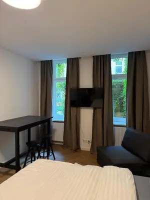 Ein Bett oder Betten in einem Zimmer der Unterkunft Pension Marie Prenzlauer Berg