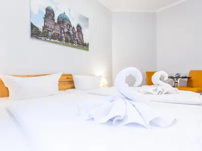 Ein Bett oder Betten in einem Zimmer der Unterkunft Pension Marie Prenzlauer Berg