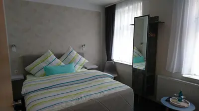Ein Bett oder Betten in einem Zimmer der Unterkunft Restaurant Rosengarten