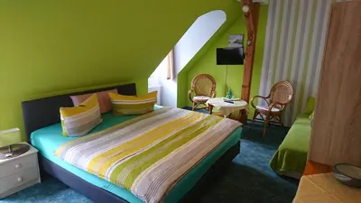 Ein Bett oder Betten in einem Zimmer der Unterkunft Restaurant Rosengarten