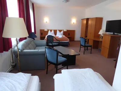 Ein Bett oder Betten in einem Zimmer der Unterkunft Pension Seeterrasse