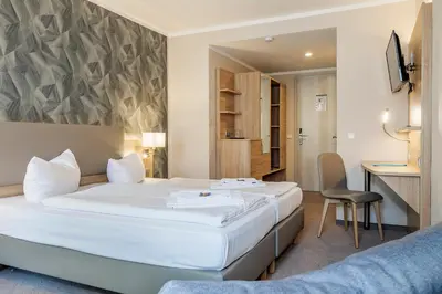 Ein Bett oder Betten in einem Zimmer der Unterkunft Hotel Alter Markt