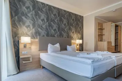 Ein Bett oder Betten in einem Zimmer der Unterkunft Hotel Alter Markt