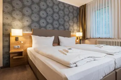 Ein Bett oder Betten in einem Zimmer der Unterkunft Hotel Alter Markt