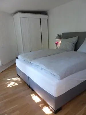 Ein Bett oder Betten in einem Zimmer der Unterkunft Feine Laube