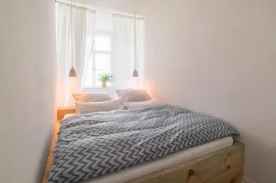 Ein Bett oder Betten in einem Zimmer der Unterkunft Design Apartments - 
