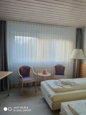 Ein Bett oder Betten in einem Zimmer der Unterkunft Seehotel Luisenhof