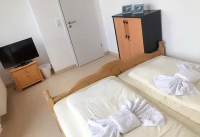 Ein Bett oder Betten in einem Zimmer der Unterkunft Seehotel Luisenhof