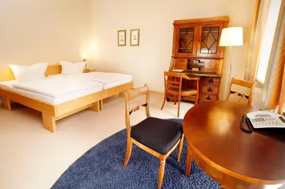 Ein Bett oder Betten in einem Zimmer der Unterkunft Gäste- und Tagungshaus am Glockengarten