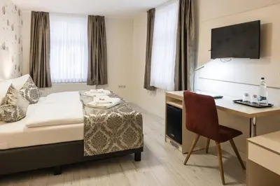 Ein Bett oder Betten in einem Zimmer der Unterkunft Novel Hotel